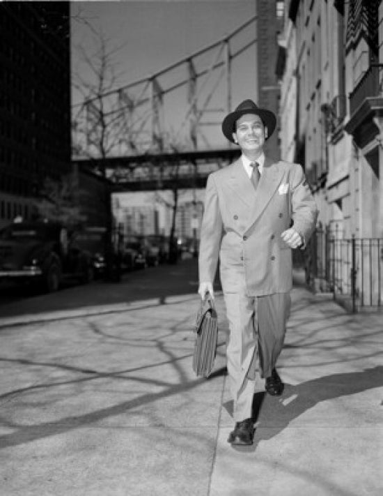 Man with briefcase walking down street poster print.