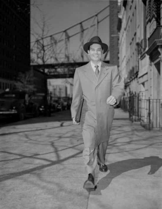 Man Walking Down Street Poster Print depicting urban life.