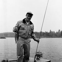 Portrait of man fishing in lake Poster Print