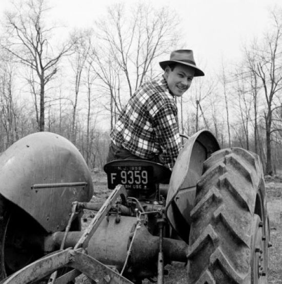 Tractor in Motion Poster Print featuring a man driving a tractor