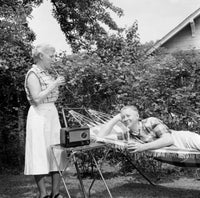 Senior couple relaxing in backyard poster print.