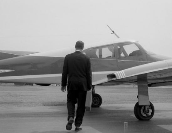 Businessman approaching private plane poster print, motivational art