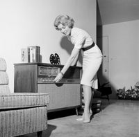 Woman Listening to Radio in Living Room Poster Print