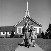 Parents and Kids in Front of Church Poster Print on premium paper.