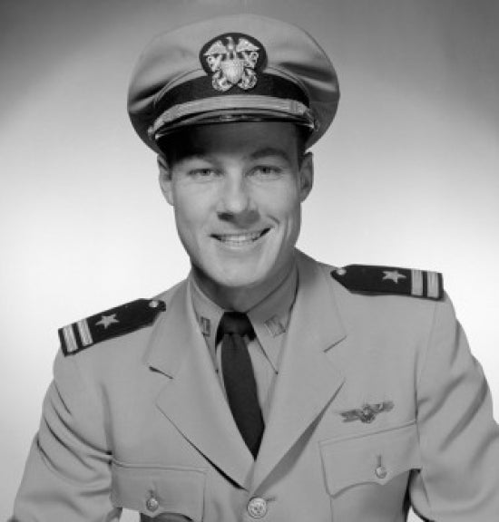 Studio portrait of a smiling male pilot poster print