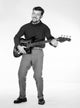 Portrait of a young man playing a bass guitar - vibrant music art poster