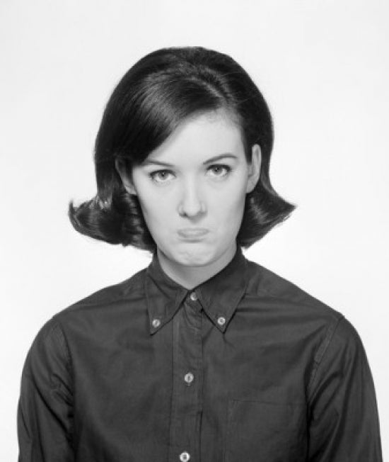 Portrait of Young Woman Sulking Poster Print showcasing emotional expression.