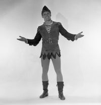 Smiling man in elf costume studio shot poster print