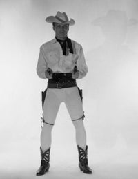 Mature Cowboy Holding Guns Poster Print showcasing rugged Western charm.