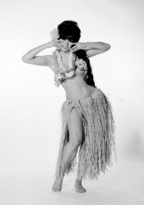 Young woman wearing grass skirt and bikini poster print.