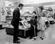 Family with Two Children in Toy Shop Poster Print