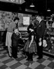 Family with Two Children in Department Store Poster Print