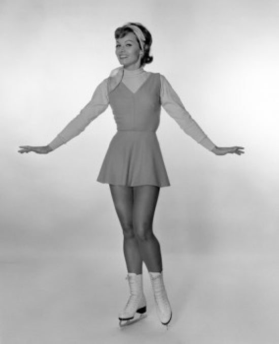 Studio portrait of young woman ice skating, vibrant colors and dynamic composition.