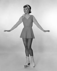 Studio portrait of young woman ice skating, vibrant colors and dynamic composition.