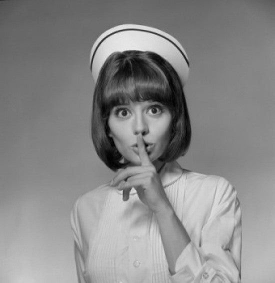 Young Nurse with Finger on Lips Fine Art Print