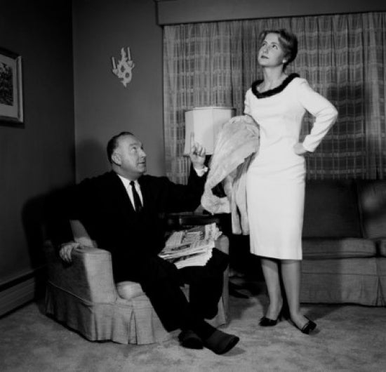 Couple in Living Room Poster Print showcasing a warm and intimate atmosphere.