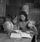 Mother with Sons Doing Homework Poster Print
