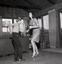 Mother dancing with son poster print showcasing family love and joy.