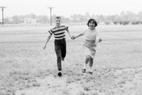 Children Running Poster Print showcasing joyful moments of childhood.