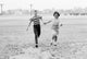 Children Running Poster Print showcasing joyful moments of childhood.