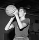 Boy Playing Basketball Poster Print showcasing dynamic action.