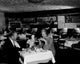 Couple Dining in Restaurant Poster Print showcasing an intimate moment.