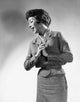 Young Woman Standing with Hands Clasped Poster Print