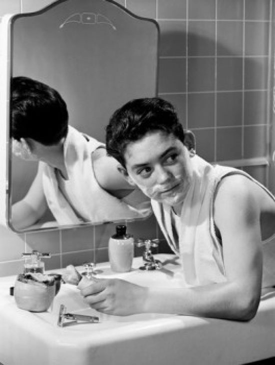 Boy Shaving Poster Print showcasing a charming childhood moment.