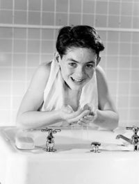 Boy Washing Face Poster Print showcasing childhood innocence
