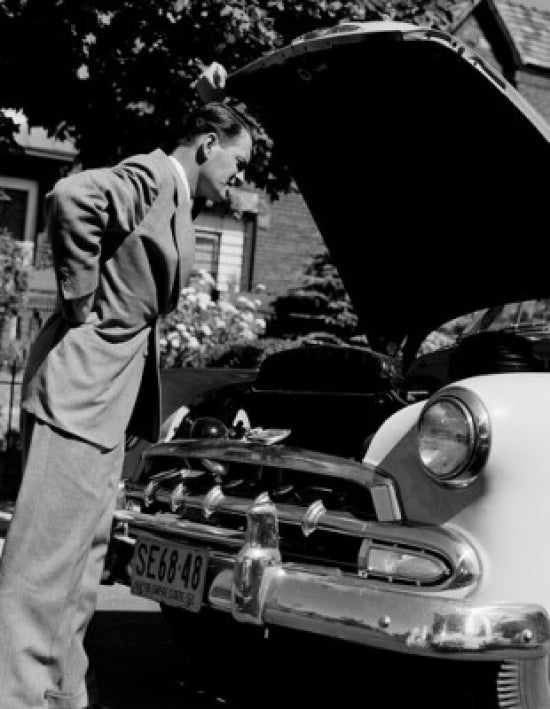 Man Looking Into Car Hood Poster Print, available in multiple sizes.