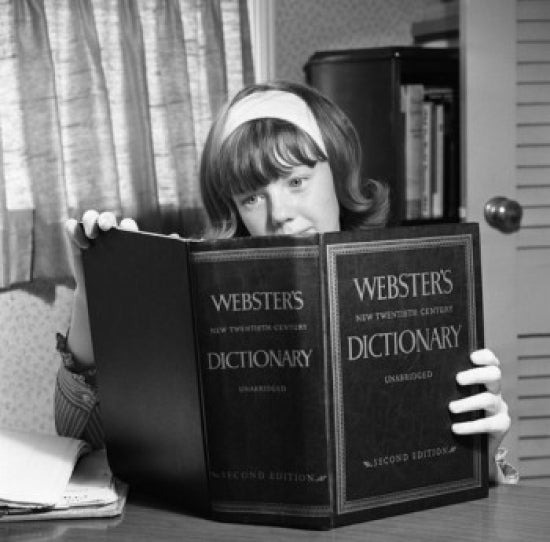 Girl Studying Webster's Dictionary Poster Print showcasing a young girl with a dictionary.