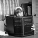 Girl Studying Webster's Dictionary Poster Print showcasing a young girl with a dictionary.