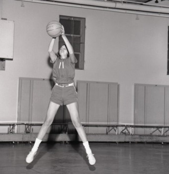 Dynamic Girl Jumping with Basketball Poster Print on premium paper.