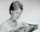 Close-up poster print of a young woman reading a newspaper, showcasing elegance and curiosity.