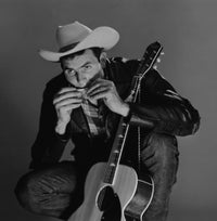 Young country musician playing harmonica poster print