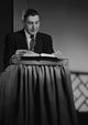 Preacher at Lectern Poster Print showcasing a preacher delivering a speech