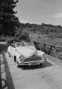 Family in Convertible Poster Print showcasing a joyful family drive.