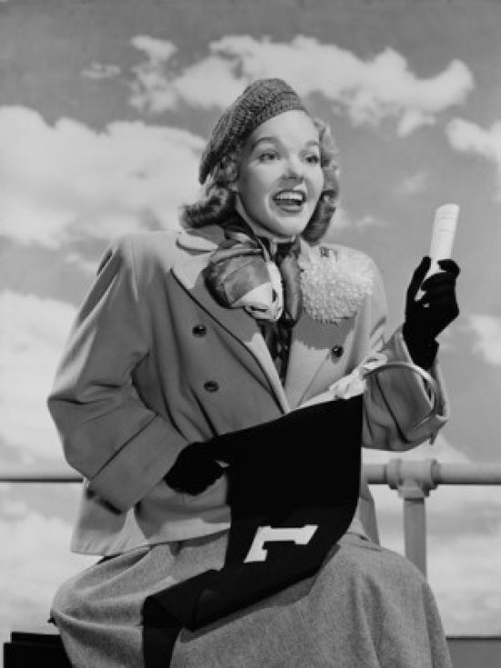 Young woman holding hook with flag and rolled up paper poster print.