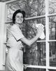 Portrait of a Young Woman Cleaning a Window Poster Print