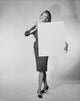 Portrait of a young woman holding a blank placard poster print