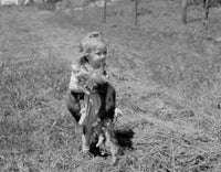 Small girl carrying cats poster print, whimsical artwork for animal lovers