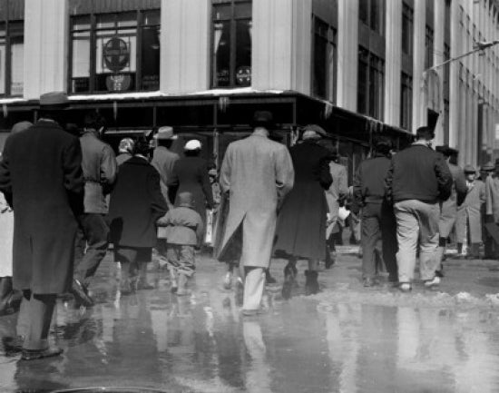 Pedestrians walking in slush on New York City streets poster print.
