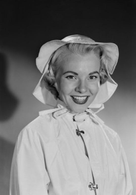 Portrait of a smiling woman in a hat - studio shot poster print.