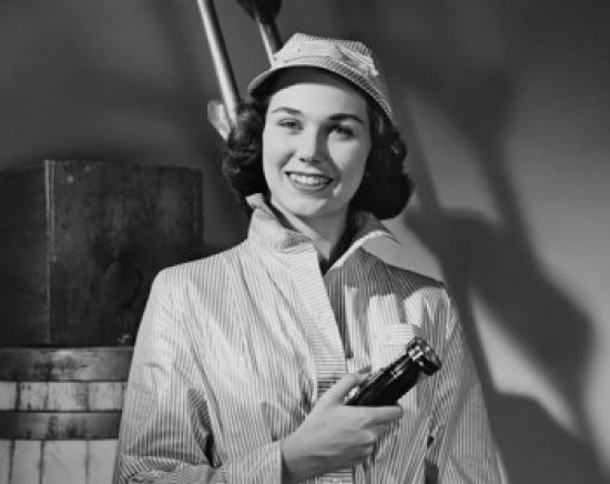 Portrait of a young woman holding a flashlight and smiling poster print