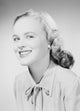 Studio portrait of a young woman smiling poster print.