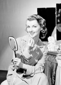 Portrait of a Young Woman Applying Makeup Poster Print