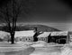 Wooden Cottage in Winter Landscape Poster Print showcasing a serene snowy scene