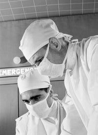 Surgeons Concentrating During Operation Poster Print showcasing medical professionals in action.