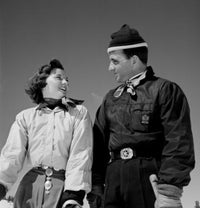 Couple in winter clothes poster print showcasing a romantic snowy scene.