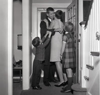 Kids Welcoming Father Home Poster Print depicting a heartwarming family scene.